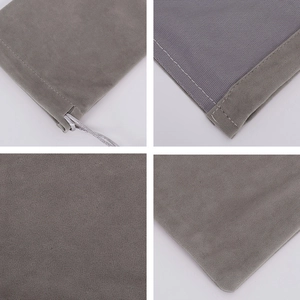 Detail view of grey velvet drawstring pouch showing cord, inner mesh lining, and soft texture