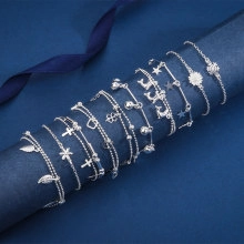 Detailed macro view of S925 silver bohemian bracelets with star and cross charms