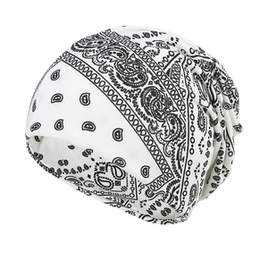 Unisex white slouchy beanie hat featuring black paisley print for hip hop fashion streetwear
