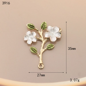 Detailed macro view of white flower and green leaf alloy charm with 35mm height dimensions