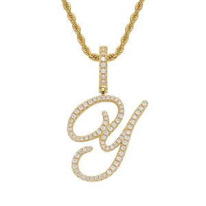 Macro detail of 18K gold plated letter Y pendant with zircon stones and rope chain