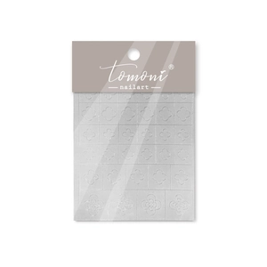 Detail view of white 3D clover floral nail art stickers on Tomoni brand packaging