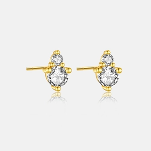 Detailed view of dual-stone 925 silver gold-plated stud earrings with cubic zirconia