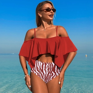 Detail of dark red ruffled off-shoulder bikini top with high-waisted zebra print bottoms
