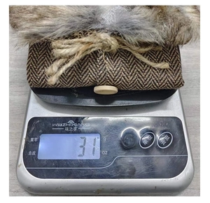Close-up of lightweight Christmas wine bottle cover weighing 31g on a scale