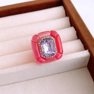 Vintage resin hexagon ring with purple crystal in a luxury velvet jewelry box