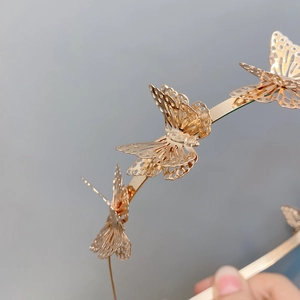 Exquisite gold 3D hollow butterfly metal headband for women featuring intricate patterns