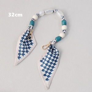 Detail of 32cm luxury chain bag strap with blue scarf and bead woven texture