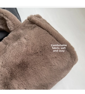 Close-up of fluffy brown plush tote bag showing the thick faux fur texture and soft fabric