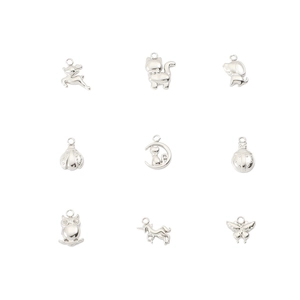 Macro view of silver stainless steel animal charms featuring deer owl and butterfly shapes