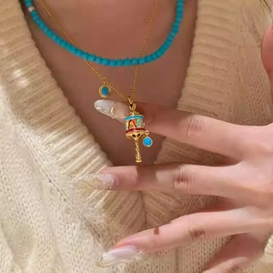 Vintage ethnic rattle pendant necklace with colorful enamel and layered blue beaded chain