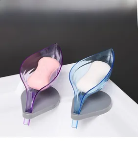 Leaf-shaped soap dishes in blue and purple with efficient drainage for bathroom sinks