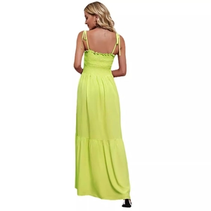 Neon green strapless maxi dress with thin straps and ruffled hem, back view of the model