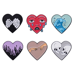 Set of 6 creative heart enamel pins featuring artistic skull and ocean wave designs