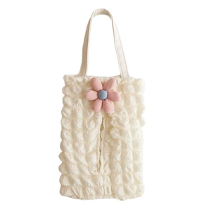 Detail of cream bubble fabric car tissue holder with pink floral accent and top handle