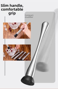 Macro view of stainless steel cocktail muddler with ergonomic handle and textured head