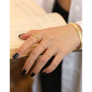 Elegant gold plated hammered rings and textured open bangle set for women on model hand