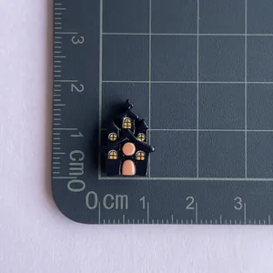Miniature black haunted house resin charm for Halloween DIY crafts with orange door