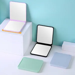 Portable folding compact makeup mirror set in pink black blue and green pastel colors