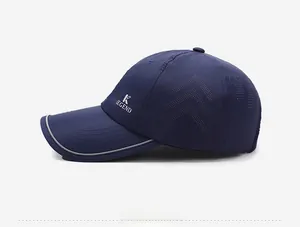 Detail of dark blue quick-dry baseball cap with laser-cut holes and reflective brim
