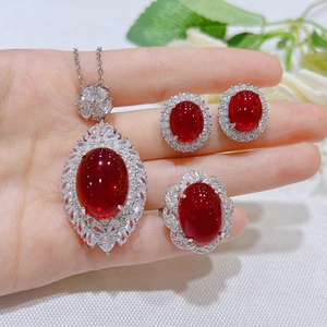 Pigeon blood ruby jewelry set featuring large oval red stones and zircon in silver plating