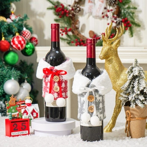 Knitted Christmas wine bottle covers with white fur collars and wooden buttons