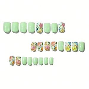 Glossy short square press-on nails set featuring light green color and small floral patterns