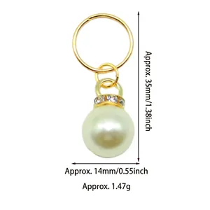 Detail view of gold pearl pendant with 14mm bead and 35mm height dimensions shown