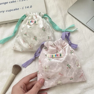 Cute velvet bear drawstring storage bags in pink and white with floral patterns