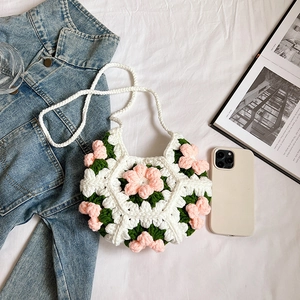 Handmade crochet puff flower crossbody bag with pink 3D floral accents on white knit