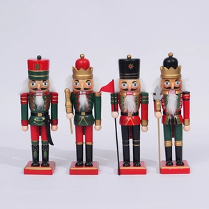 Detail view of four wooden nutcracker soldiers with hand-painted festive uniforms and weapons