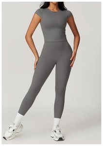 Detail of high-waist grey yoga leggings and tight crop top for fitness and gym wear