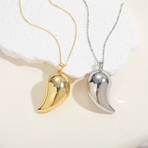 Minimalist teardrop pendant necklaces in 14K gold and silver finish on white rock base