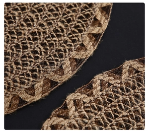 Macro view of braided cotton-blend round placemat with detailed textured edges