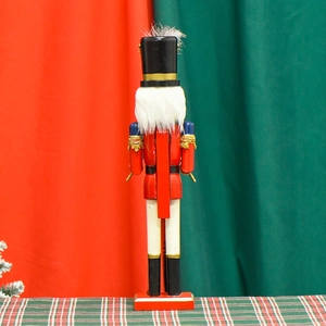 40cm red wood nutcracker soldier with feather detail and sequins on festive background