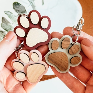 Creative wooden paw print keychains set in three colors with metallic keyring accessories