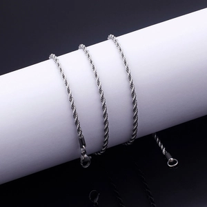 Polished stainless steel rope chain necklace with secure lobster clasp on display