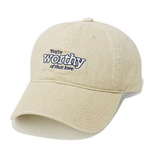 Close-up of vintage washed cotton baseball cap with embroidered inspirational quote