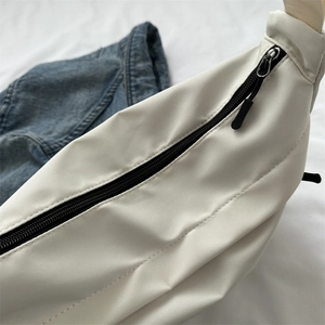 White nylon shoulder bag for women featuring a black metal zipper and durable stitching