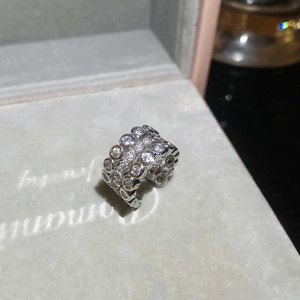 Detail of wide S925 silver ear cuff with four layers of shimmering cubic zirconia stones
