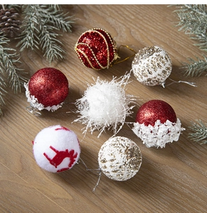 Detail of Christmas tree balls with sequins, plush textures, and reindeer silhouettes