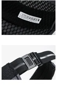 Detail of black sports visor showing mesh fabric, sports logo and adjustable buckle
