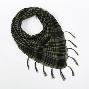 Detail of army green tactical shemagh scarf featuring checkered weave and fringe tassels