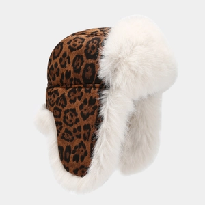 Winter faux fur trapper hat featuring classic leopard print and warm ear flaps for cold weather
