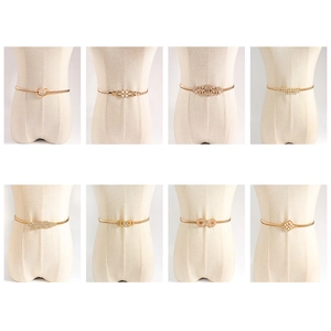 Elastic gold metal waist chain set featuring heart, pearl, and rhinestone buckles