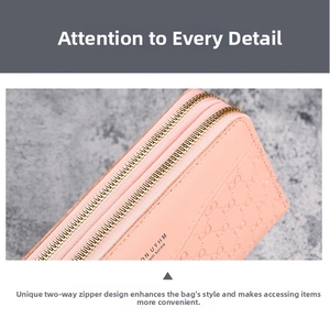 Detail of pink long wallet showing dual gold zippers and embossed luxury pattern texture