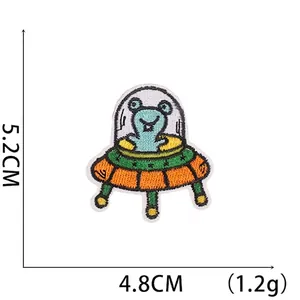 Detail shot showing 5.2x4.8cm dimensions of a cartoon UFO embroidered patch for DIY crafts