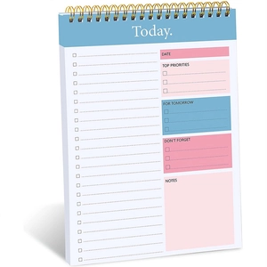 Minimalist daily planner notepad with spiral binding, perfect for time management and goals.