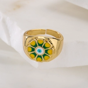 Bohemian gold plated adjustable ring with enamel flower and blue evil eye detail
