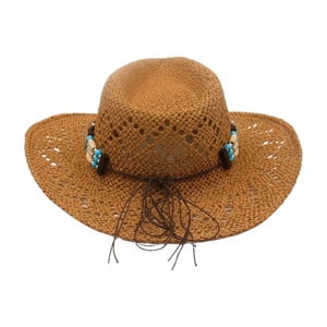 Detail of woven straw cowboy hat featuring ethnic beads and decorative fringe tassels